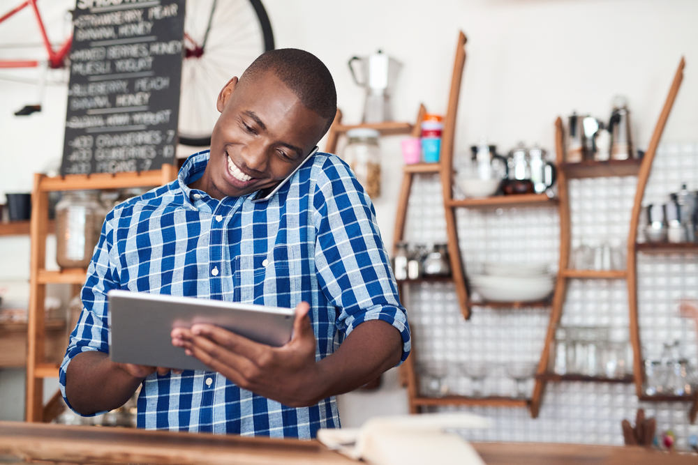 business owner emailing electronic invoice on tablet